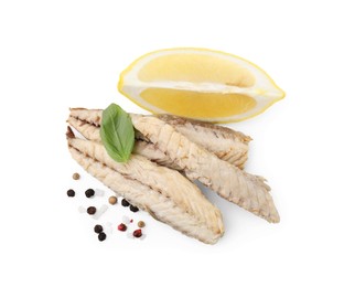 Photo of Canned mackerel fillets with lemon, basil and spices on white background, top view