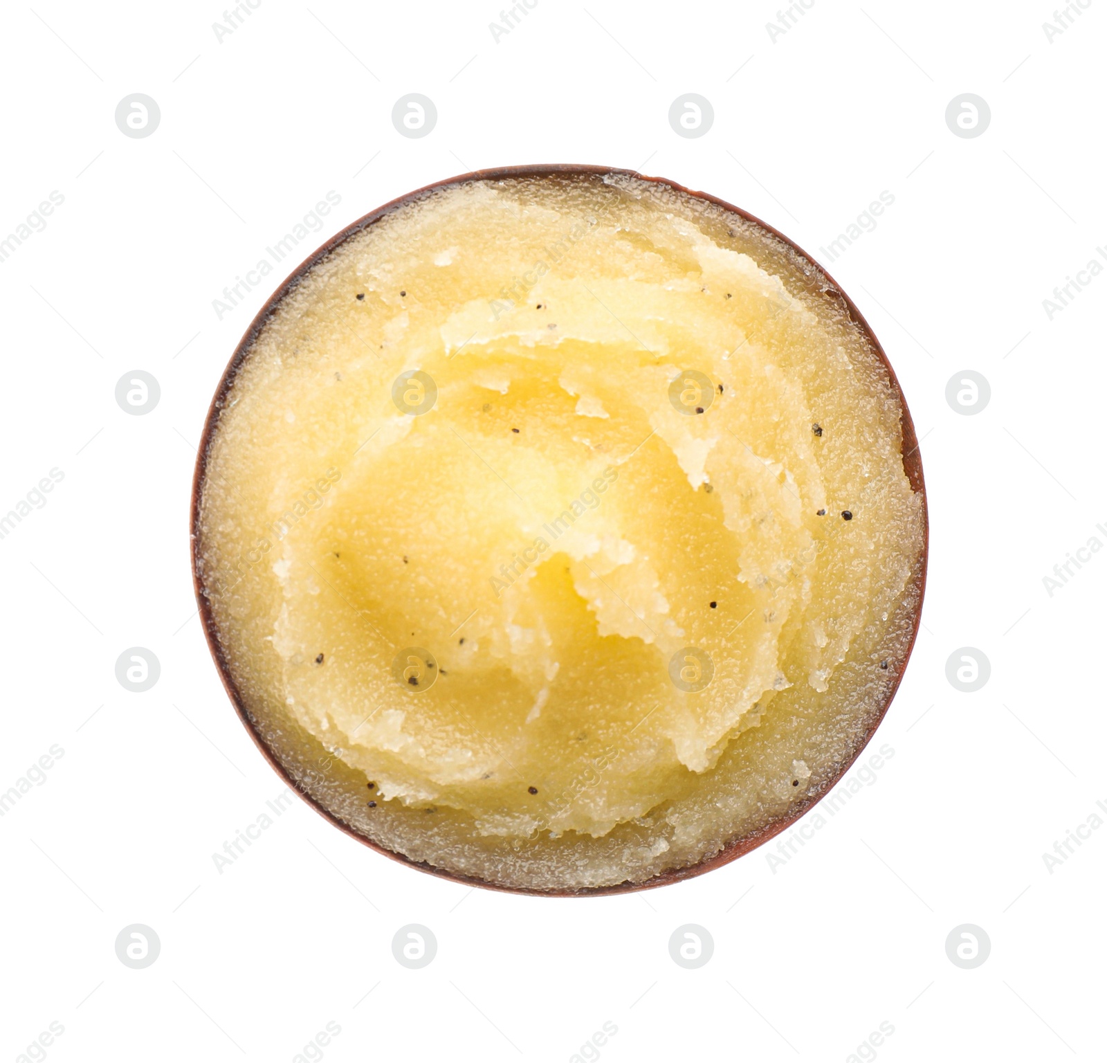 Photo of Bowl of yellow body scrub isolated on white, top view