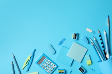 Photo of Different stationery on light blue background, flat lay with space for text. Back to school