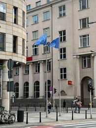 WARSAW, POLAND - JULY 17, 2022: Flags of European Union fluttering on city street