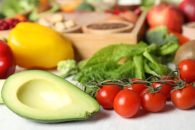 Many different healthy food on white table, closeup