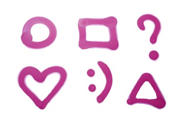 Photo of Symbols drawn by pink spray paint on white background