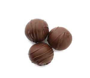 Delicious sweet chocolate truffles on white background, top view