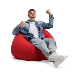 Photo of Emotional man gesturing on red bean bag chair against white background