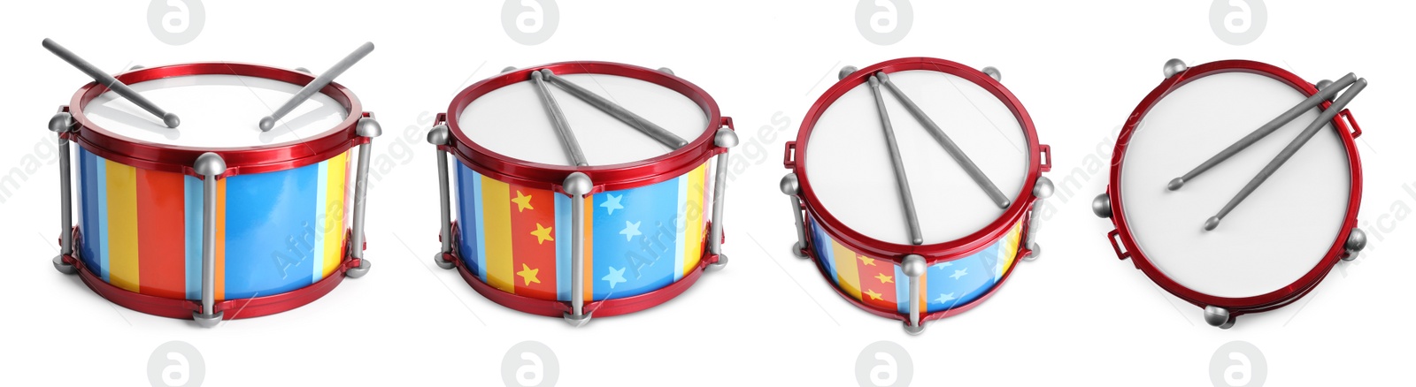 Image of Bright toy drums and sticks on white background, set