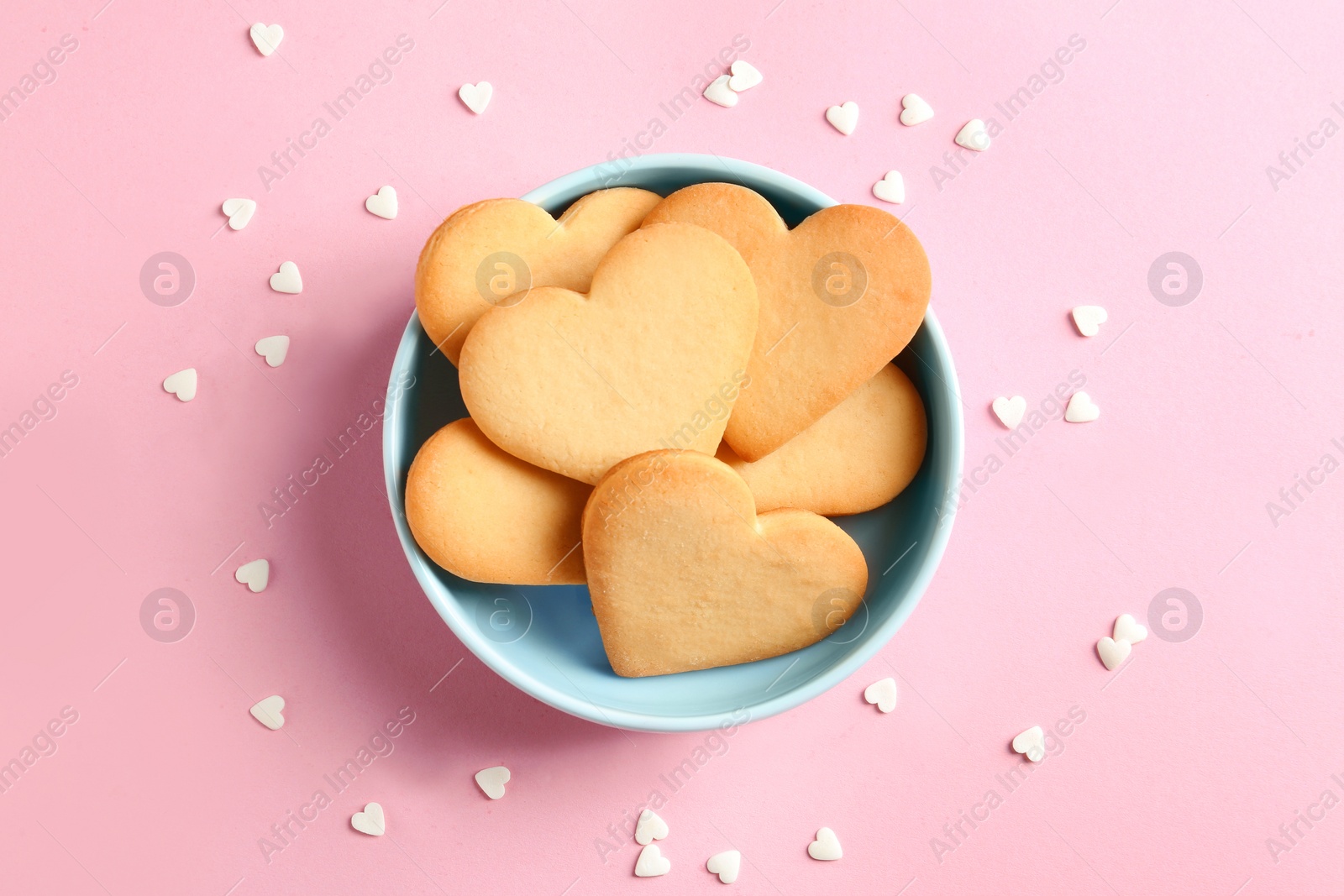 Photo of Flat lay composition with homemade heart shaped cookies on color background