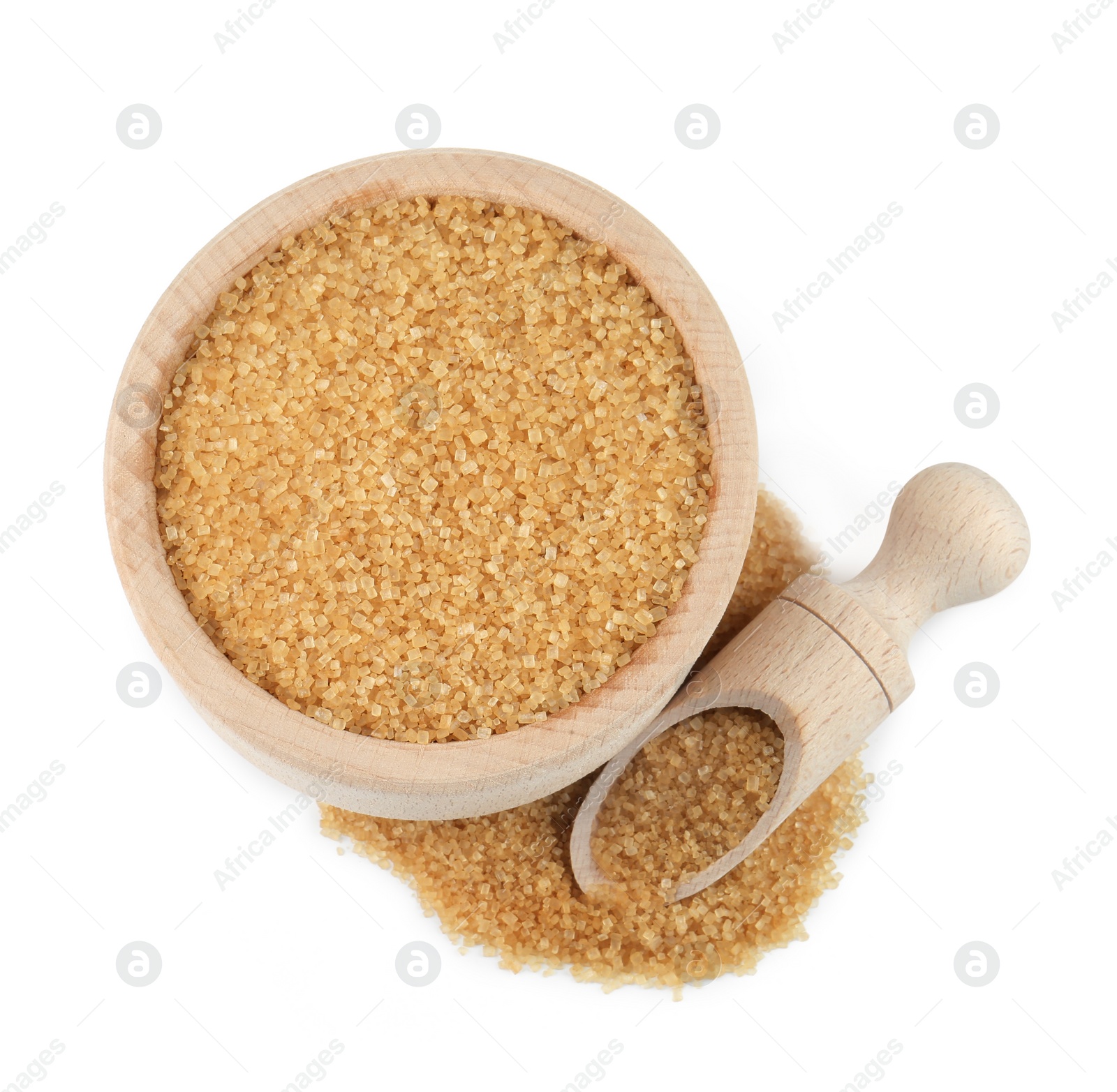 Photo of Brown sugar in bowl and scoop isolated on white, top view