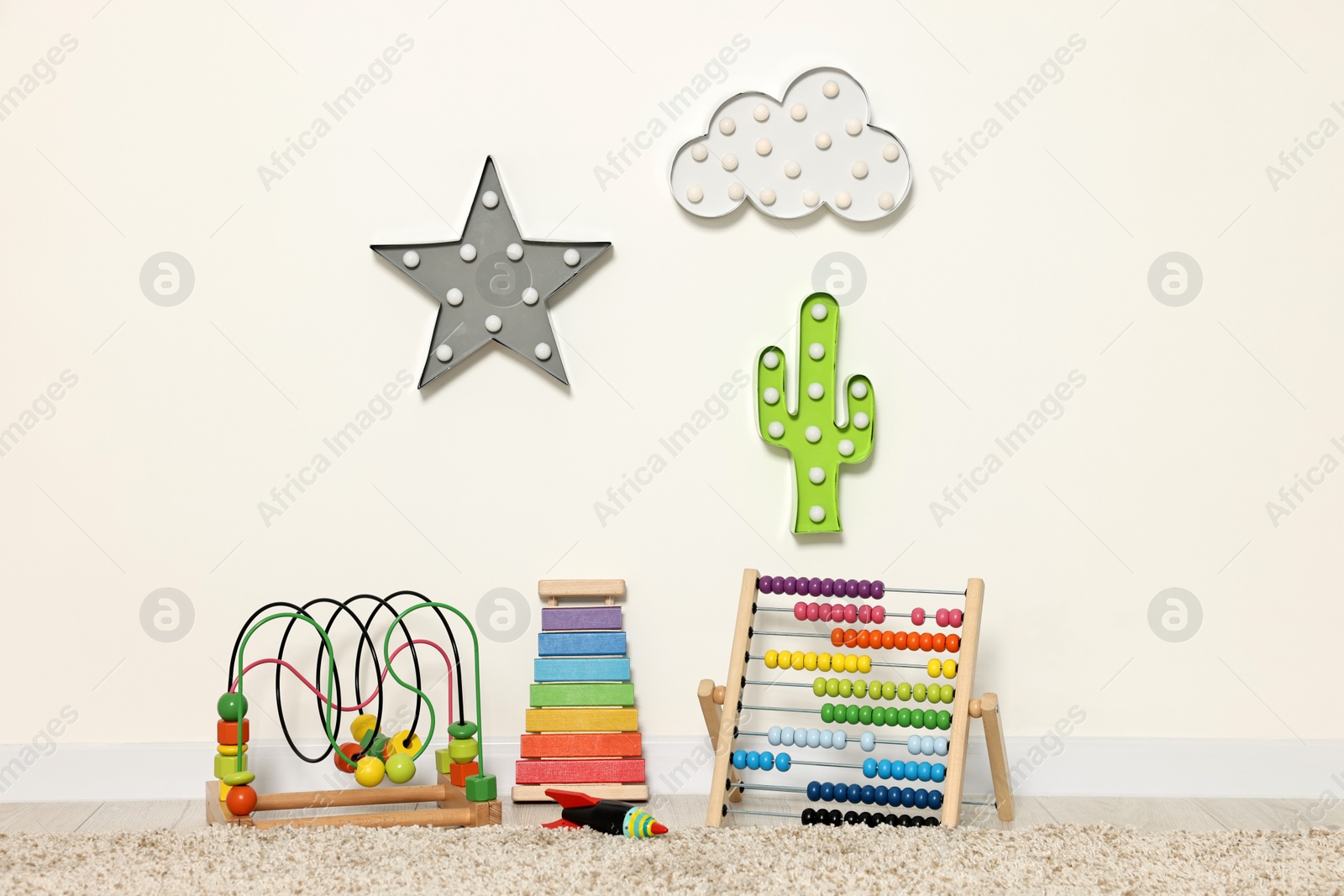 Photo of Educational toys and nightlights in beautiful children's room