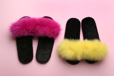 Photo of Different soft slippers on light pink background, flat lay