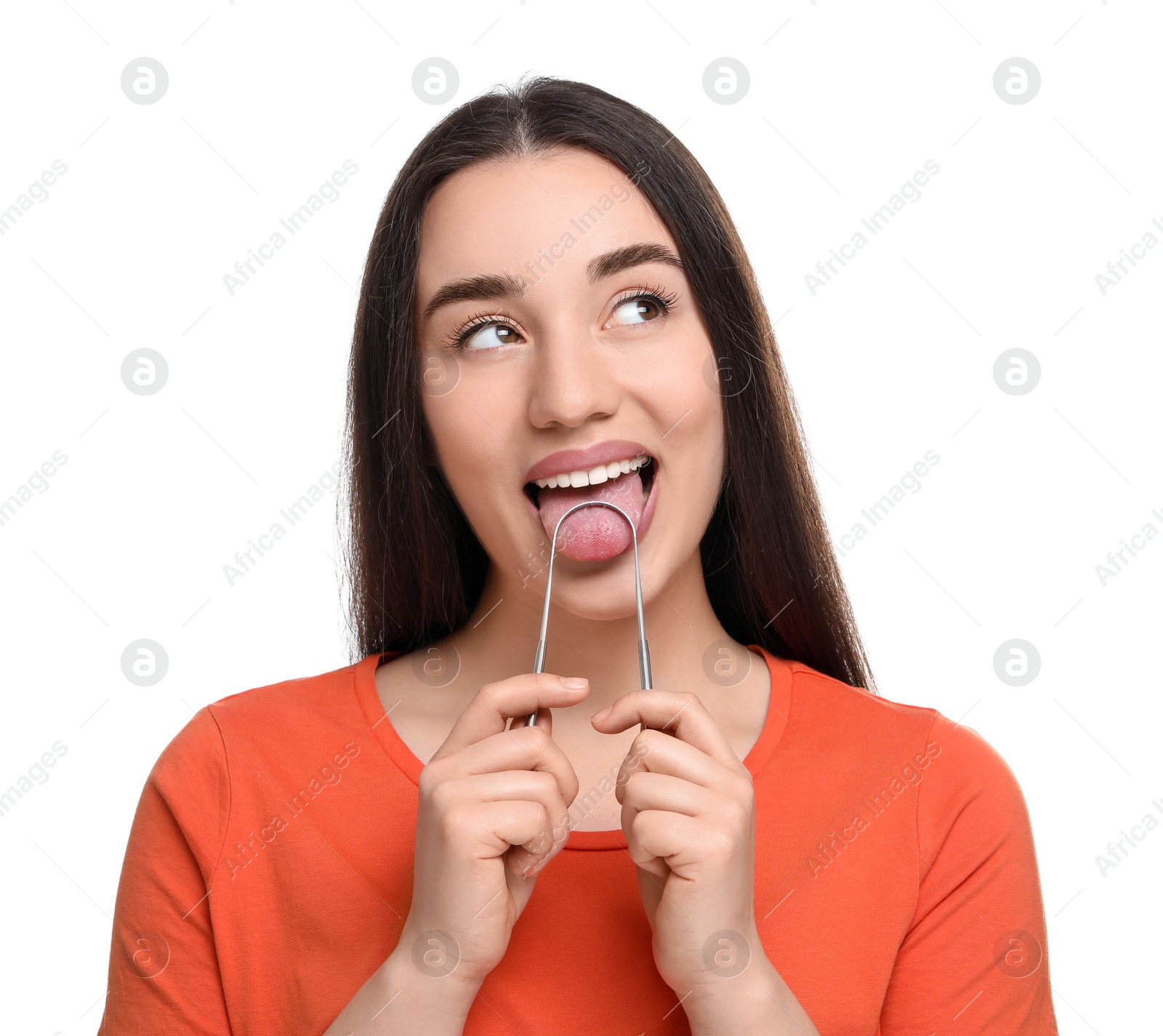 Photo of Happy woman brushing her tongue with cleaner on white background