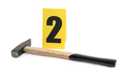 Photo of Hammer and crime scene marker with number two isolated on white