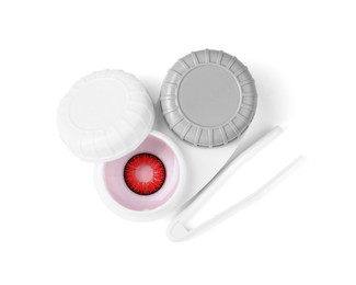Photo of Case with red contact lenses and tweezers isolated on white, top view
