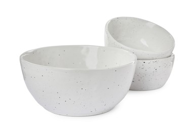 Beautiful empty ceramic bowls on white background