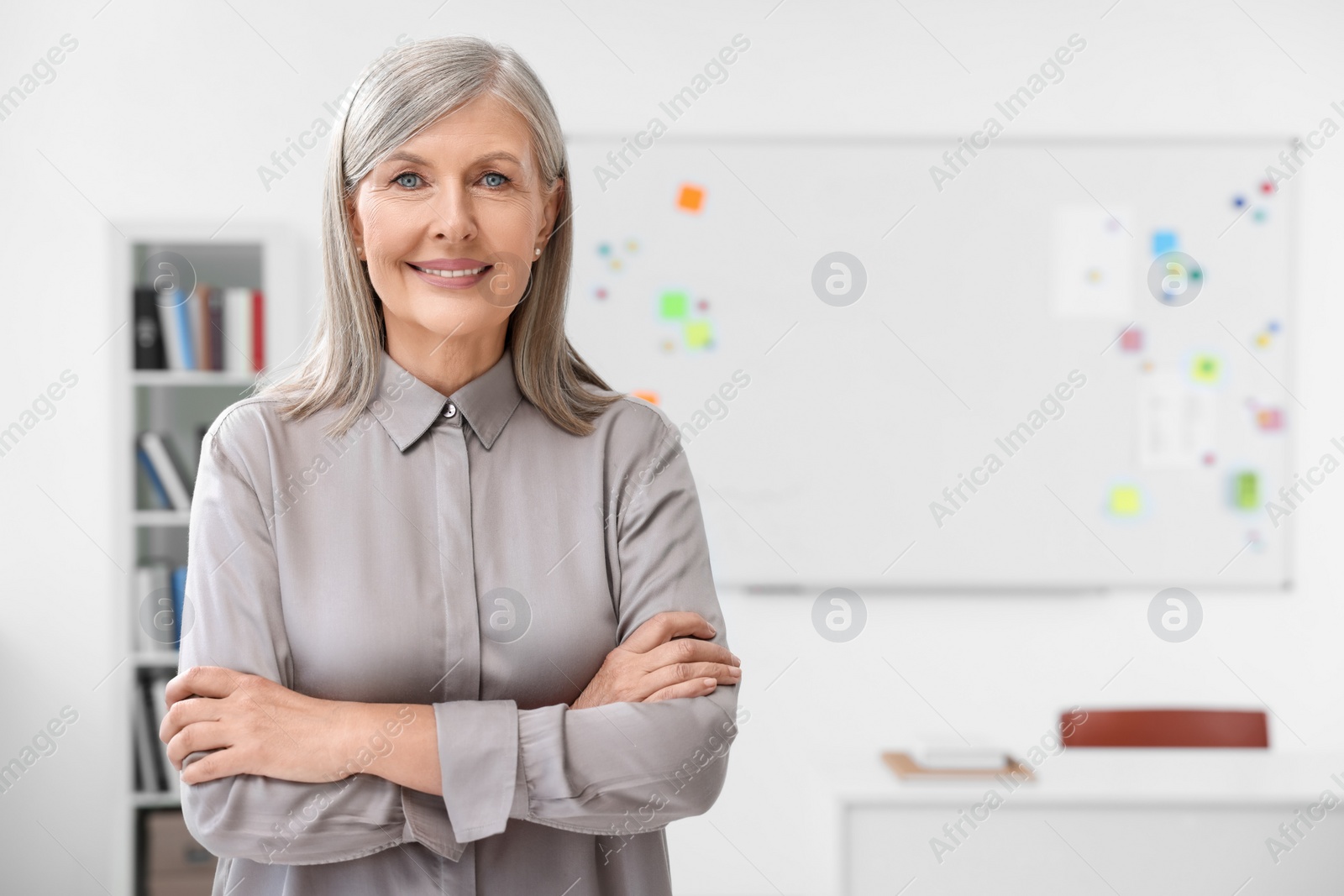 Photo of Portrait of happy professor in classroom, space for text