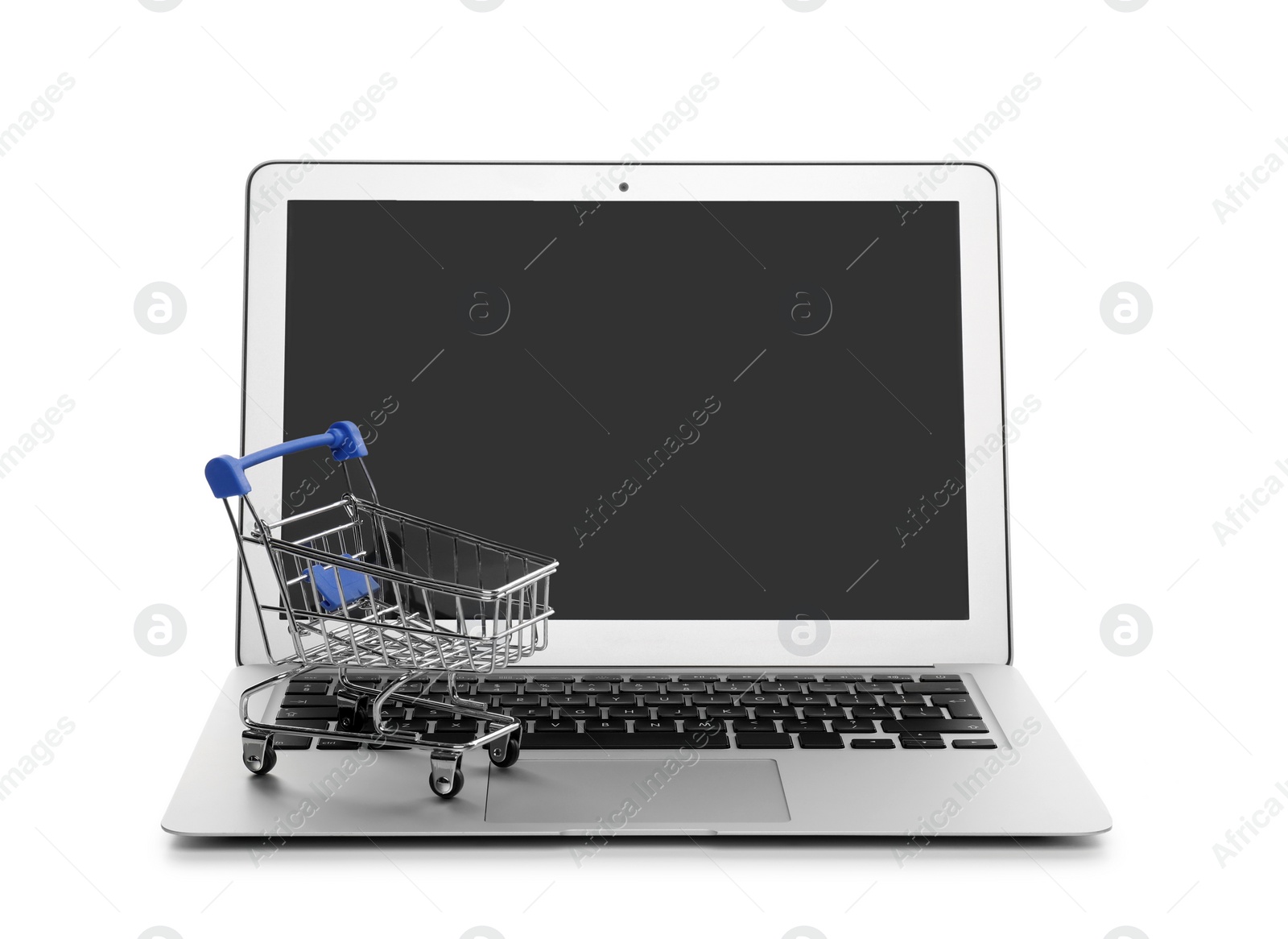 Photo of Internet shopping. Laptop with small cart isolated on white