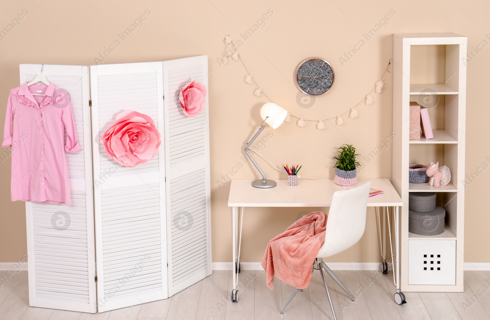 Photo of Cozy child room interior with study station and modern decor elements