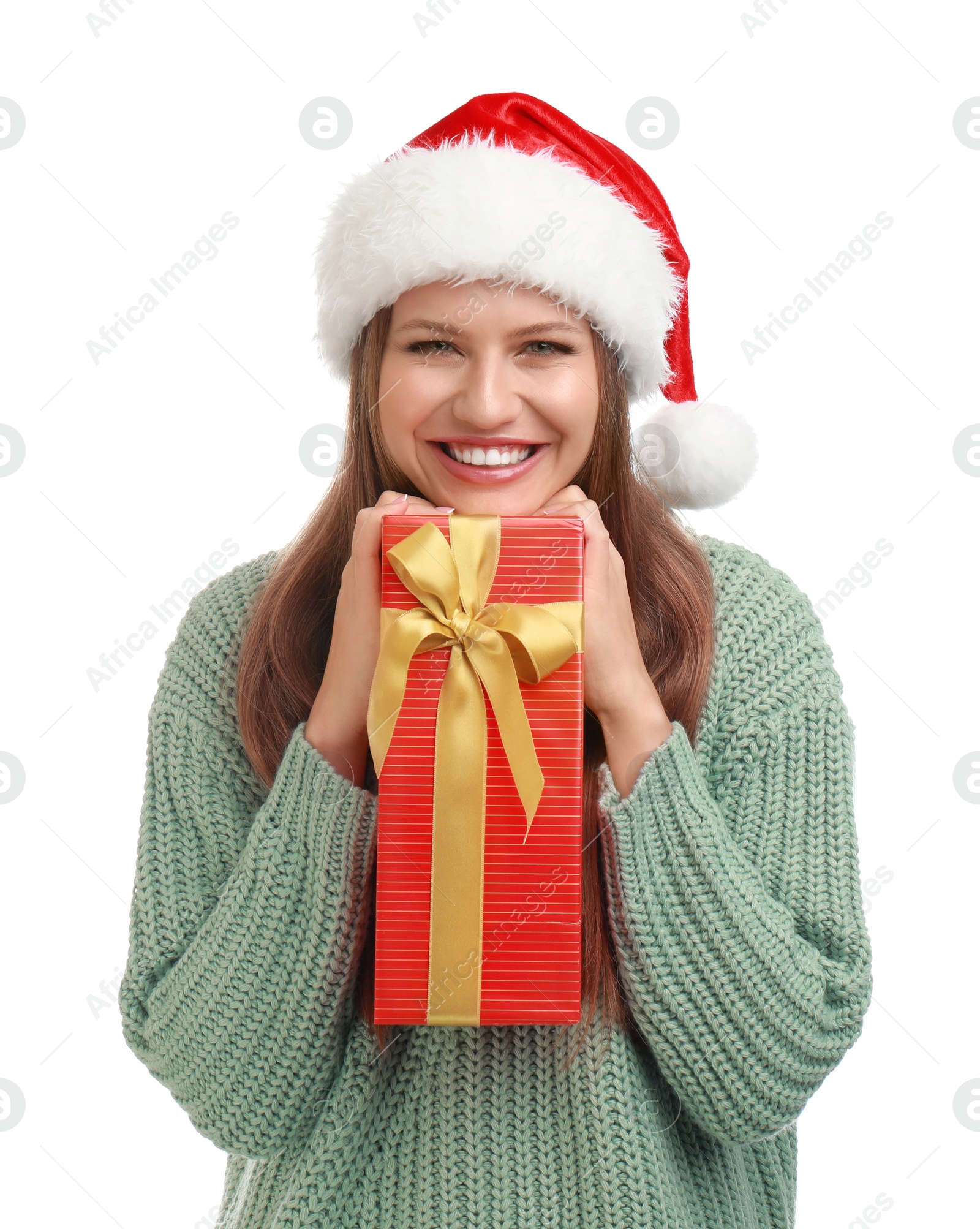 Photo of Happy young woman in Santa hat with Christmas gift on white background