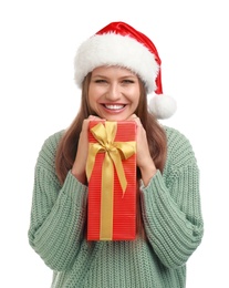 Photo of Happy young woman in Santa hat with Christmas gift on white background