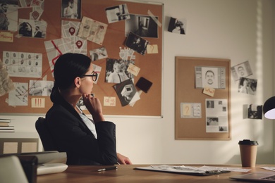 Detective working at desk in her office