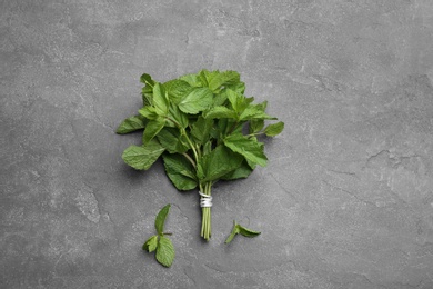 Photo of Bunch of fresh mint on grey background, top view