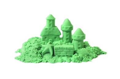 Photo of Castle figures and starfish made of green kinetic sand isolated on white