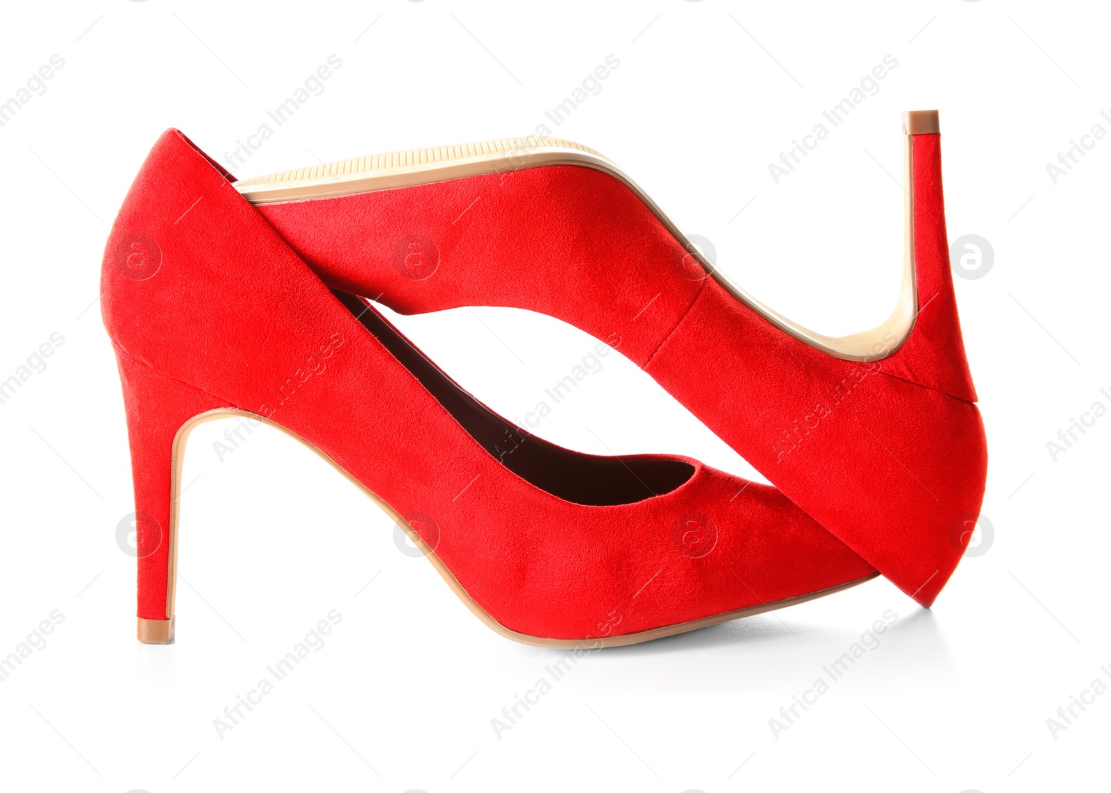 Photo of Pair of red female shoes on white background