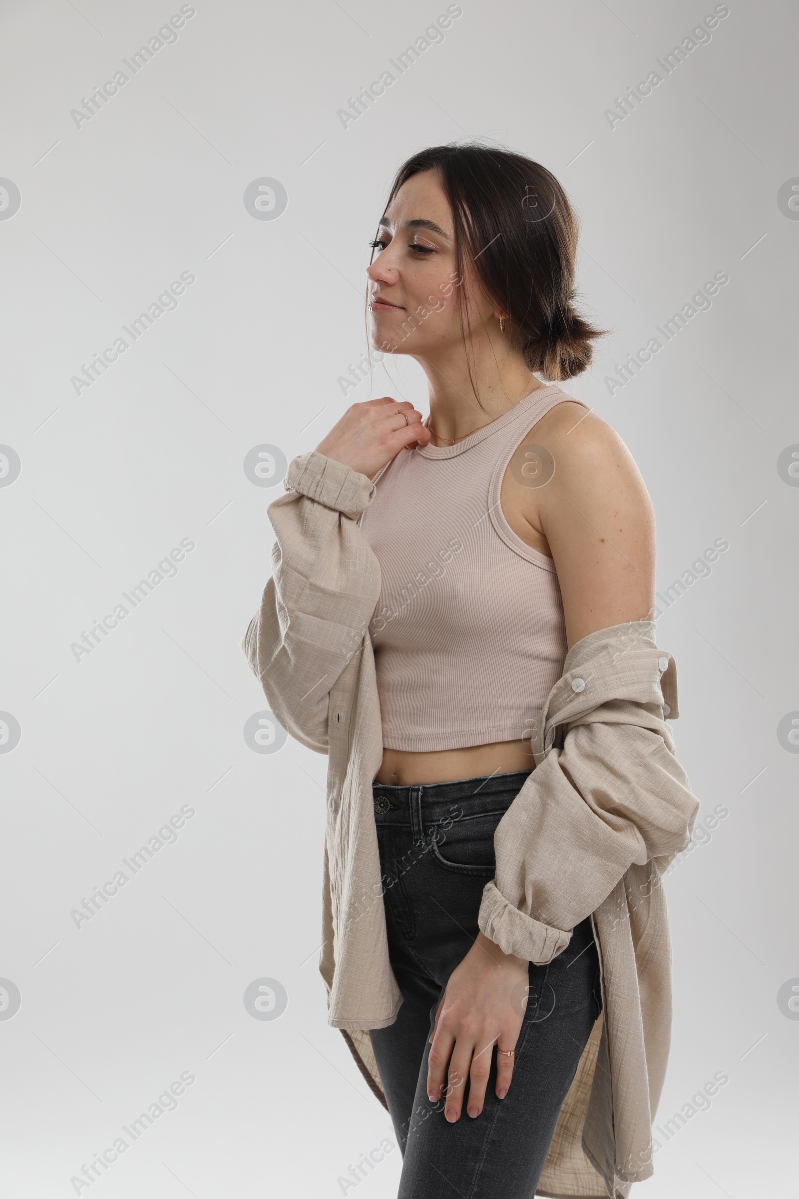 Photo of Portrait of beautiful woman on light grey background