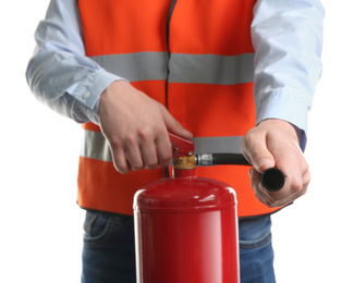 Worker using fire extinguisher on white background, closeup