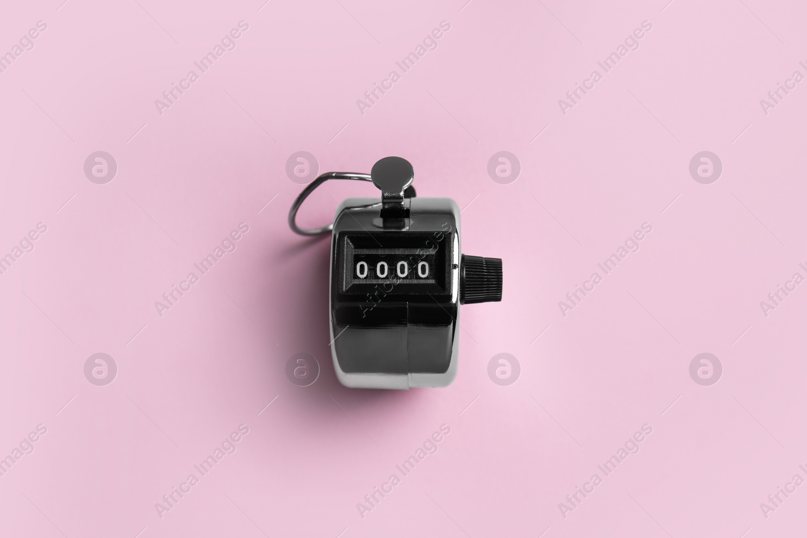 Photo of Modern timer on pink background, top view
