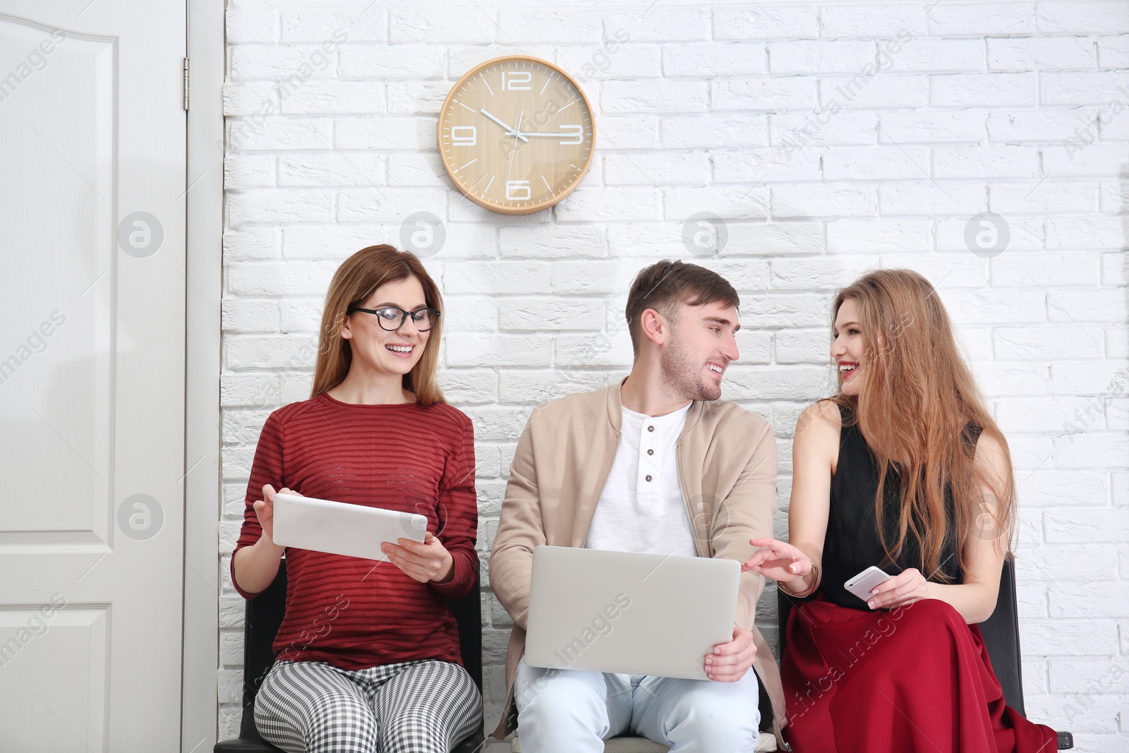 Photo of Group of people waiting for job interview, indoors