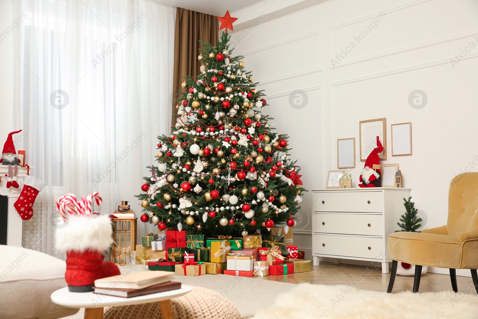 Photo of Festive living room interior with Christmas tree