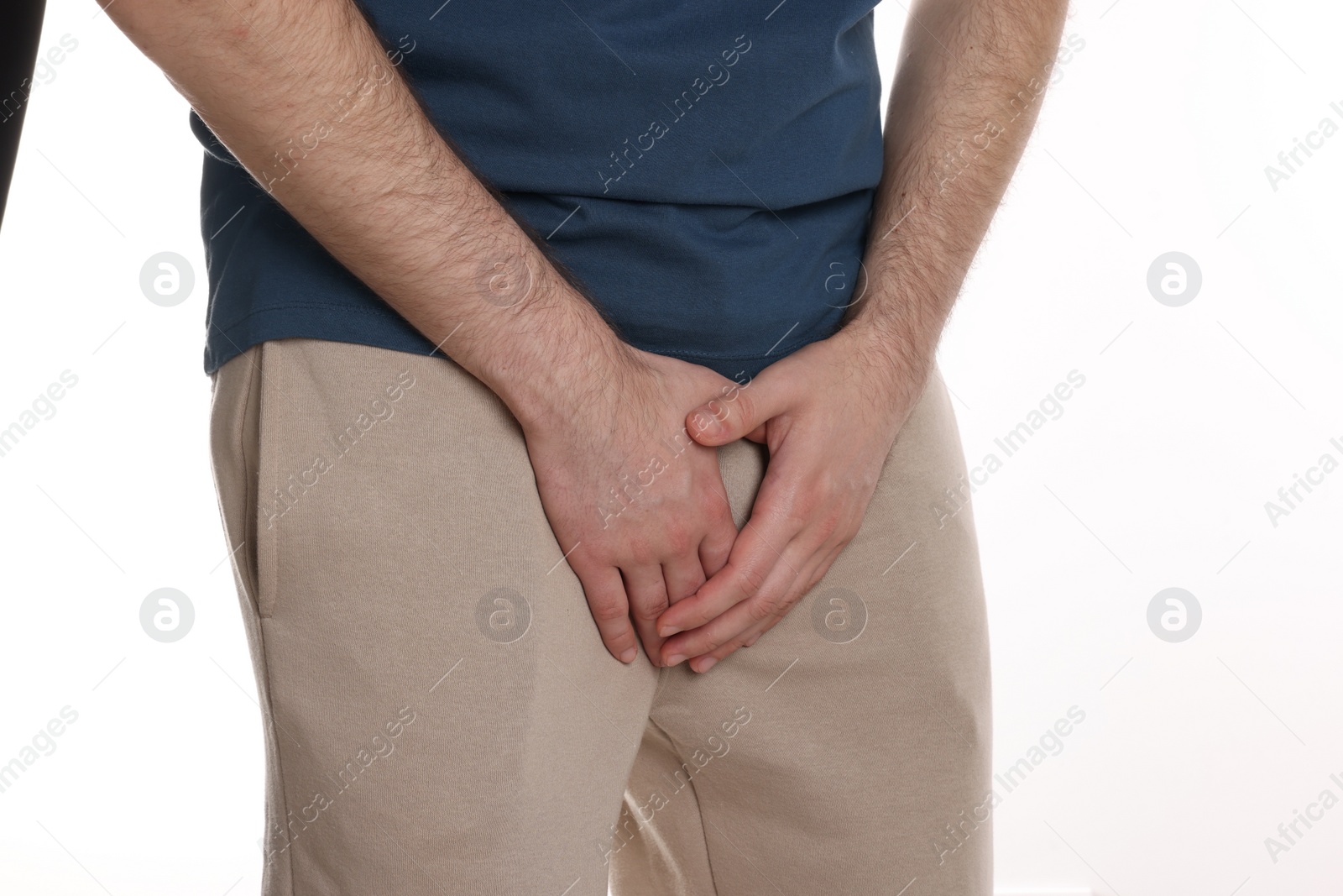 Photo of Man suffering from herpes genital on white background, closeup