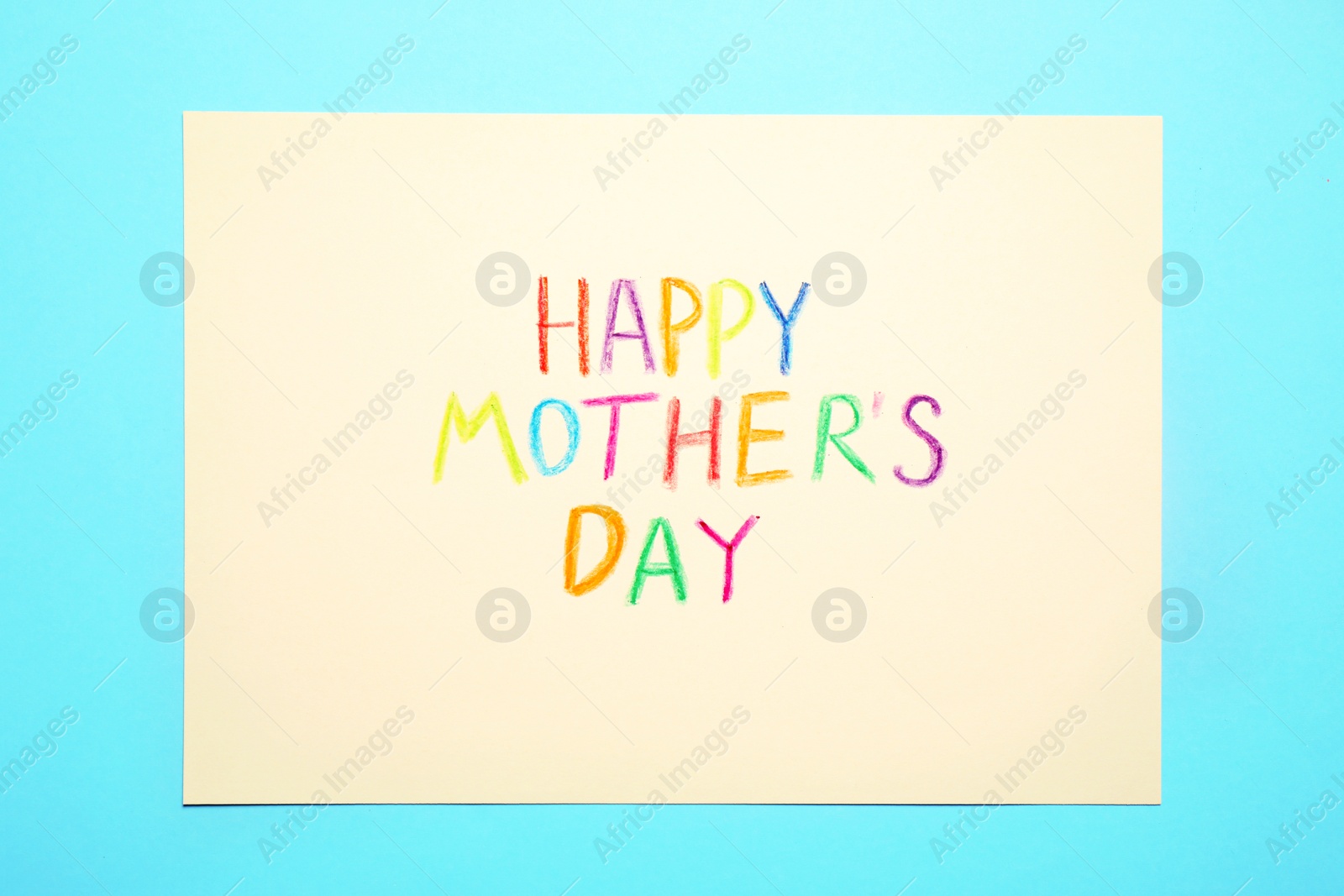 Photo of Greeting card with text Happy Mother's day on light blue background, top view
