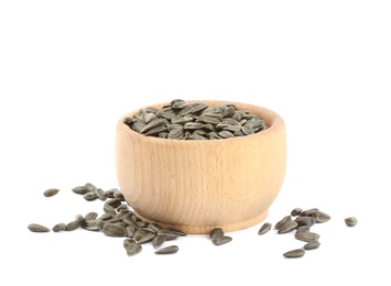 Sunflower seeds in bowl on white background