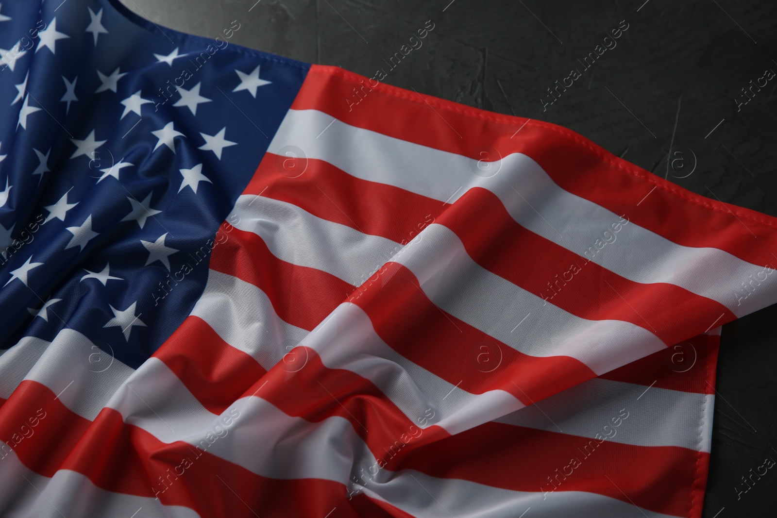 Photo of Flag of USA on black table, above view