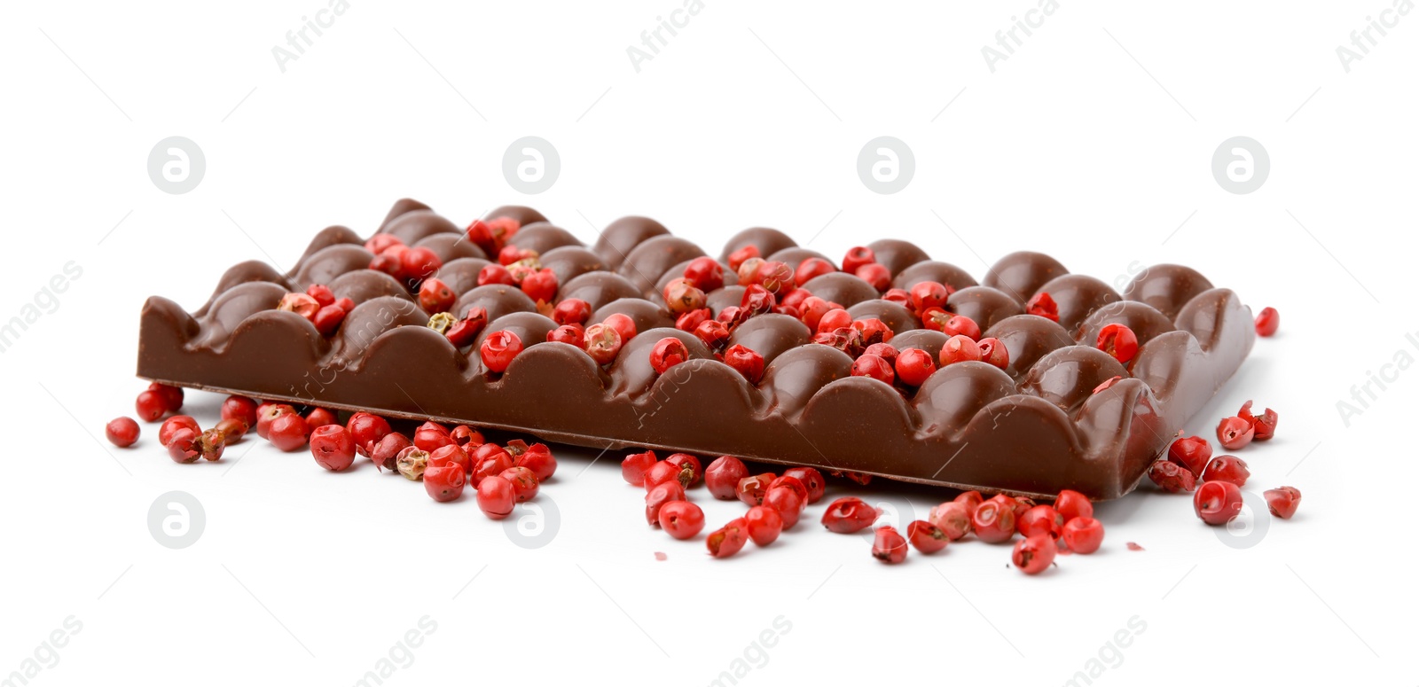 Photo of Dark chocolate bar with red peppercorns isolated on white