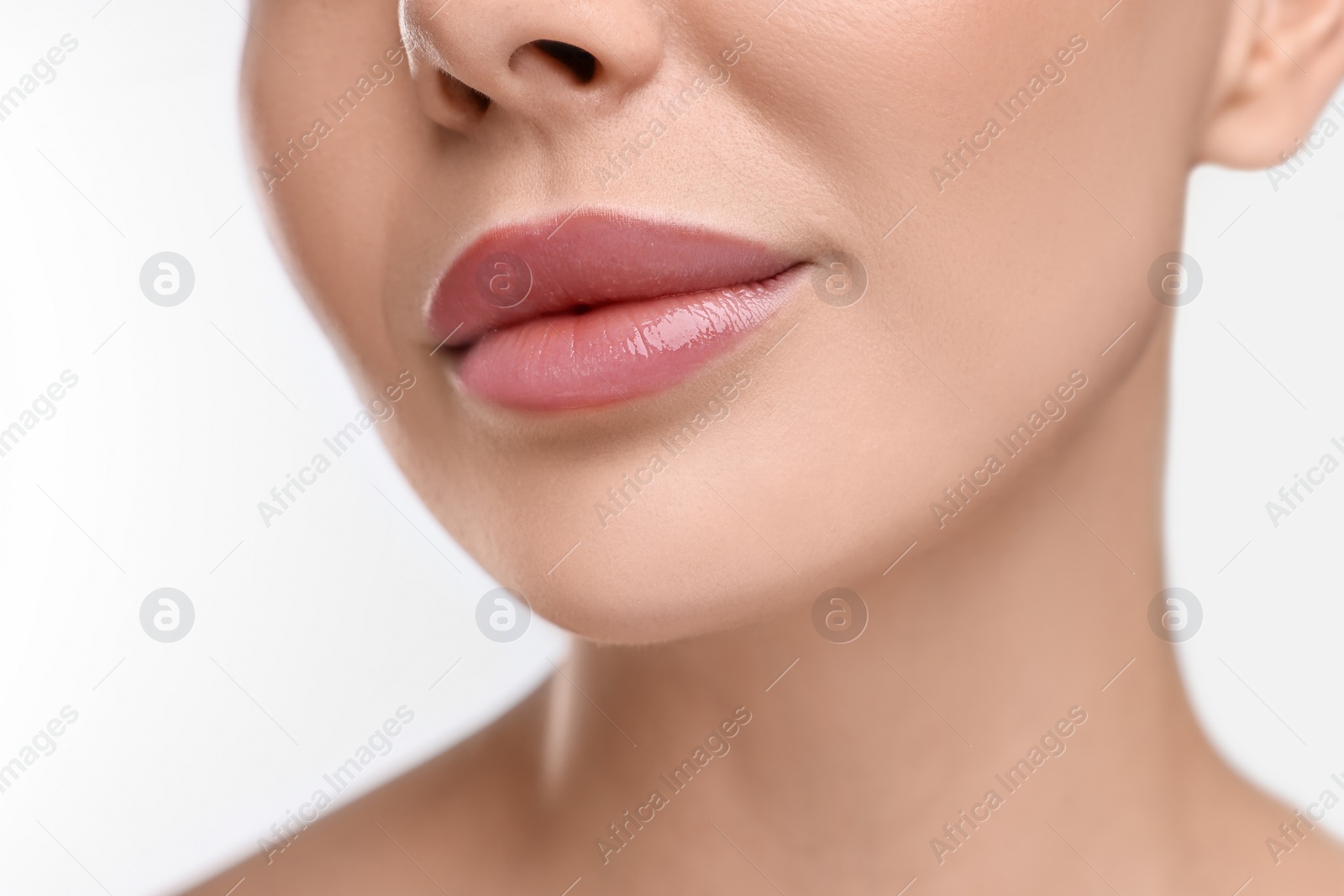 Photo of Woman with beautiful lips on white background, closeup