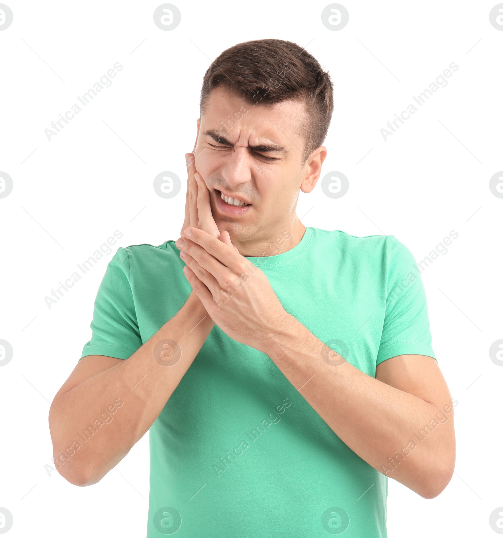 Photo of Young man suffering from toothache on white background