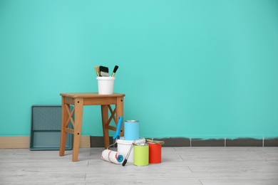 Photo of Decorator's tools near color wall