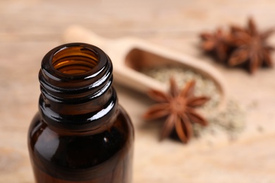 Photo of Bottle of anise essential oil, closeup. Space for text