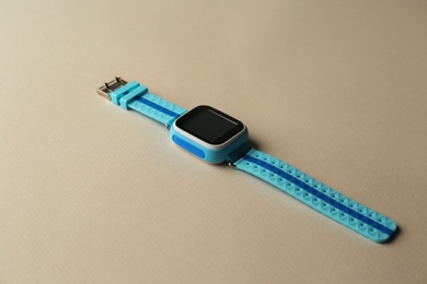 Modern trendy smart watch for kids on grey background