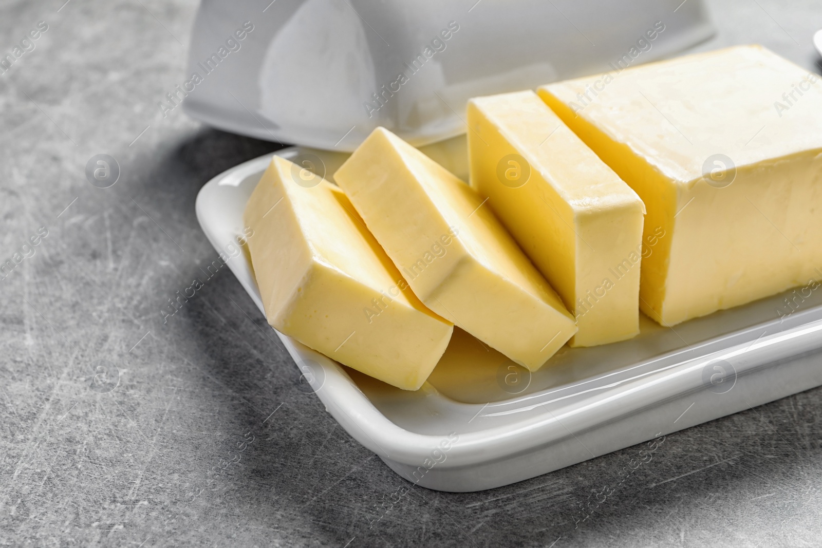 Photo of Dish with fresh butter on table, closeup