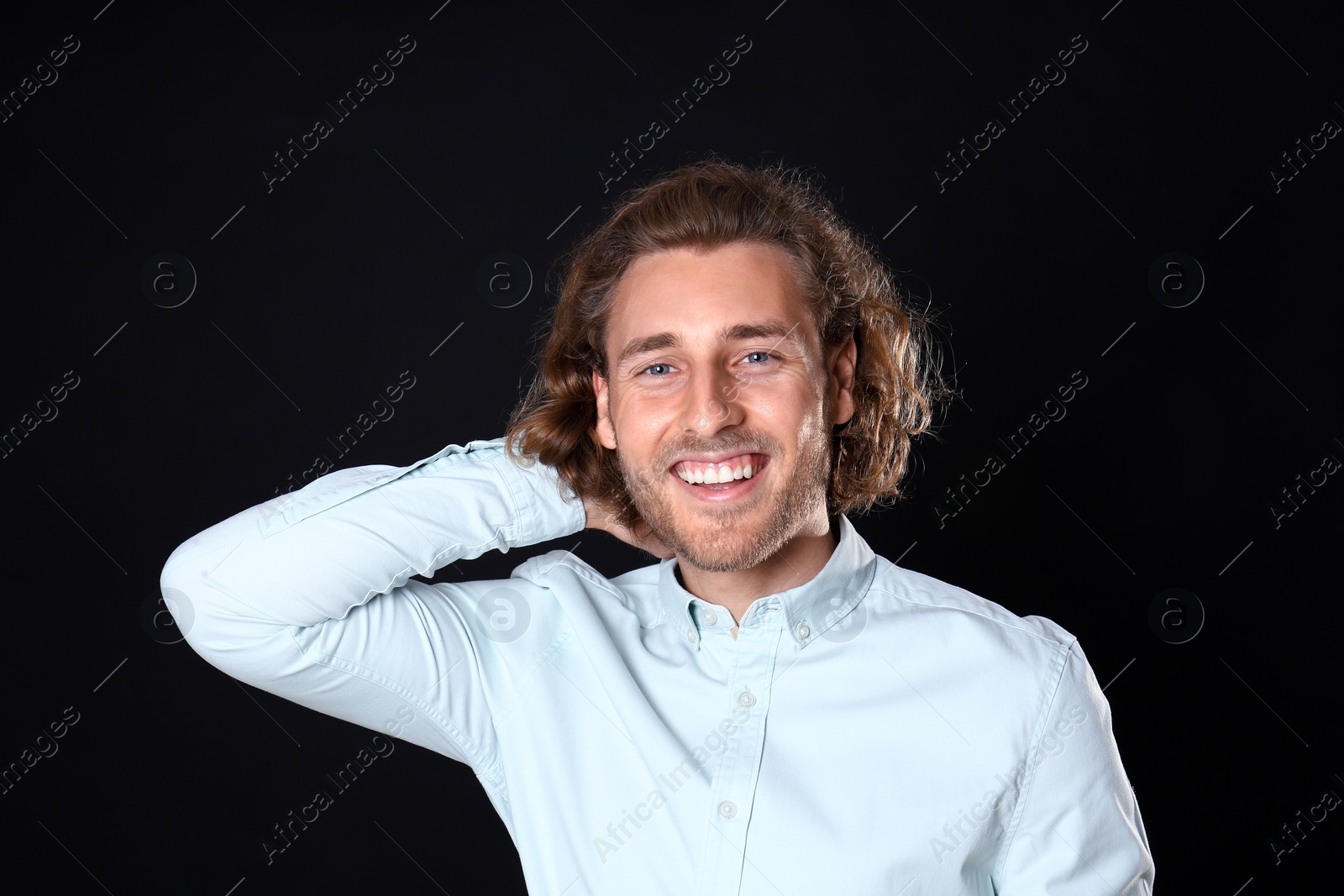 Photo of Portrait of handsome man on black background