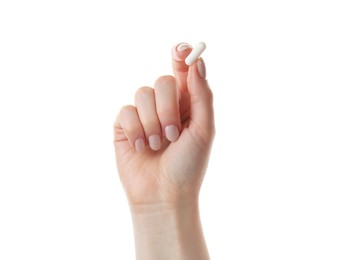 Photo of Woman holding vitamin capsule on white background, closeup. Health supplement