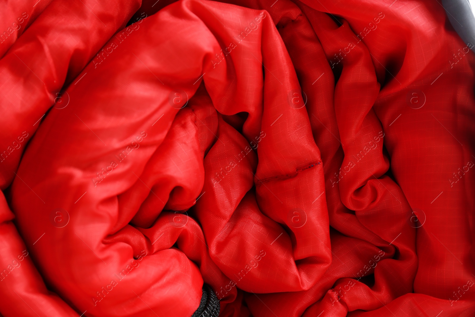 Photo of Sleeping bag as background, closeup. Camping equipment