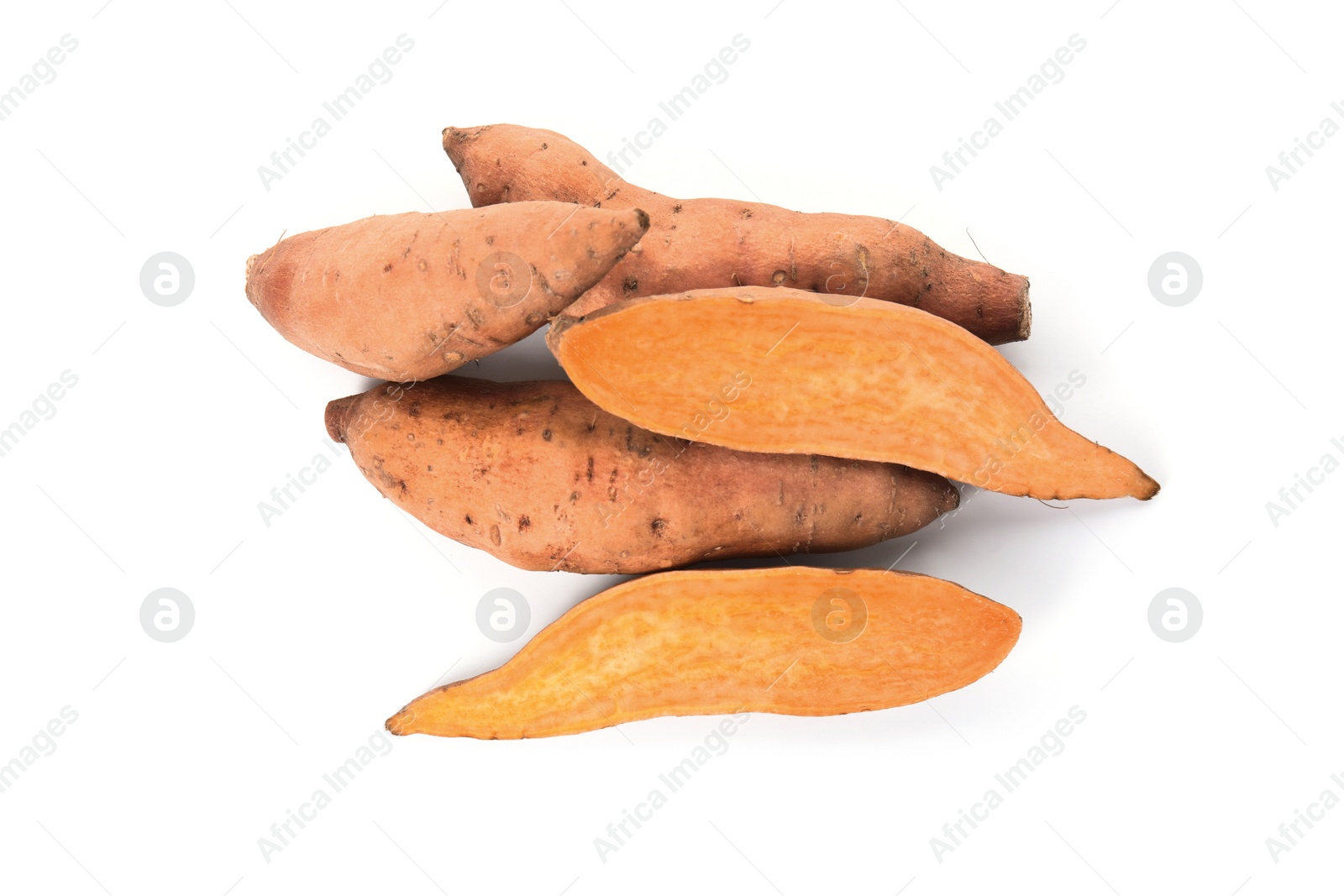 Photo of Cut and whole sweet potatoes on white background, top view