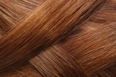 Photo of Texture of healthy red hair as background, closeup