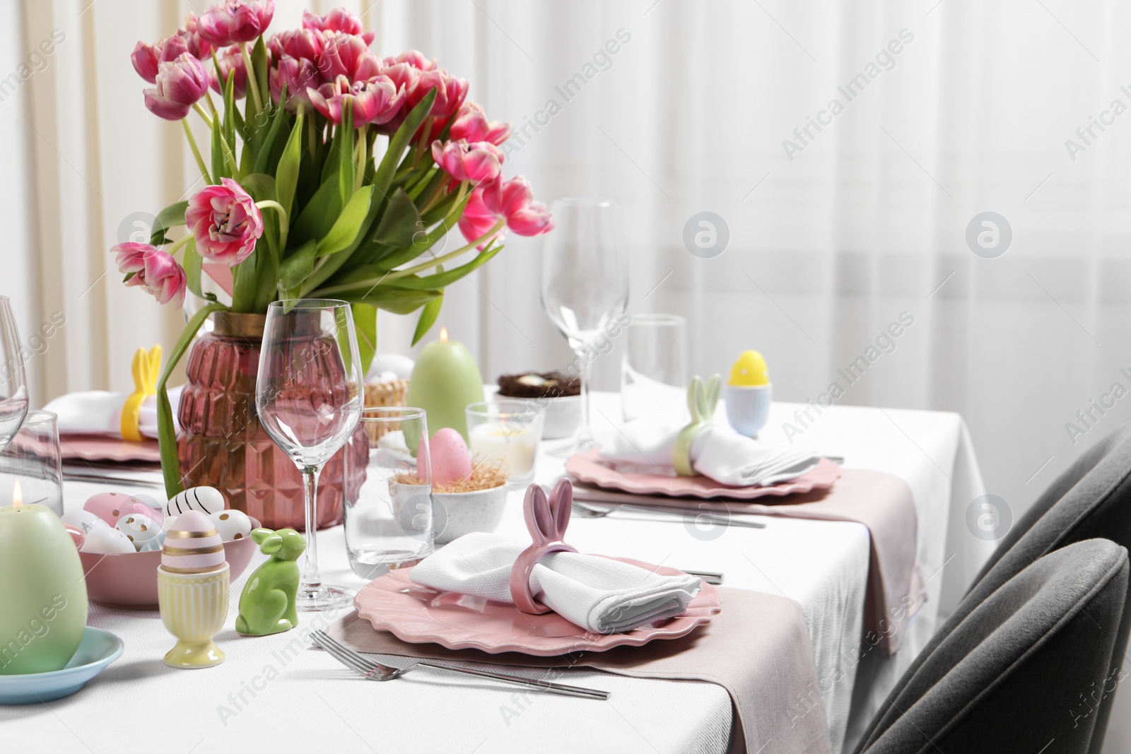 Photo of Festive table setting with beautiful flowers. Easter celebration