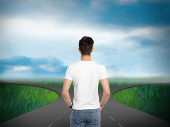 Image of Choose your way. Man standing at crossroads taking important decision