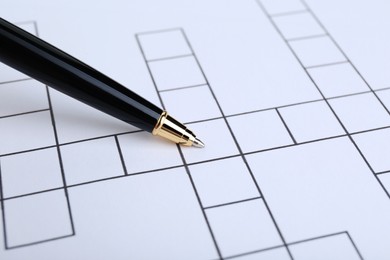 Pen and blank crossword, closeup. Space for text